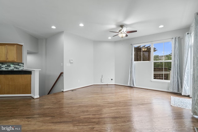 23466 Twin Falls Ter, Brambleton, VA 20148 - unfurnished living room with a ceiling fan, recessed lighting, wood finished floors, and baseboards