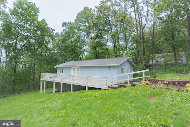 384 Nancy Jack Rd, Gerrardstown, WV 25420 - back of house with a wooden deck, a yard, and view of scattered trees