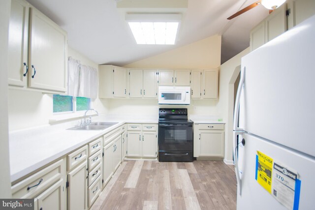 384 Nancy Jack Rd, Gerrardstown, WV 25420 - kitchen with white appliances, a sink, light wood-style flooring, light countertops, and vaulted ceiling
