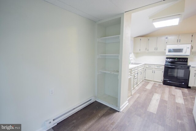 384 Nancy Jack Rd, Gerrardstown, WV 25420 - kitchen with electric range, white microwave, a sink, light wood-style floors, and light countertops
