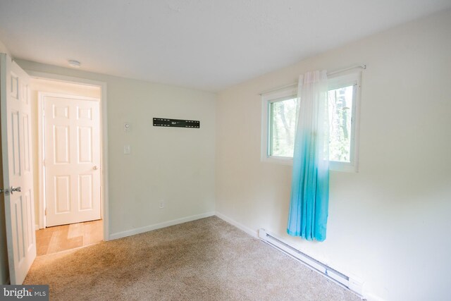 384 Nancy Jack Rd, Gerrardstown, WV 25420 - unfurnished room featuring a baseboard radiator, carpet, and baseboards