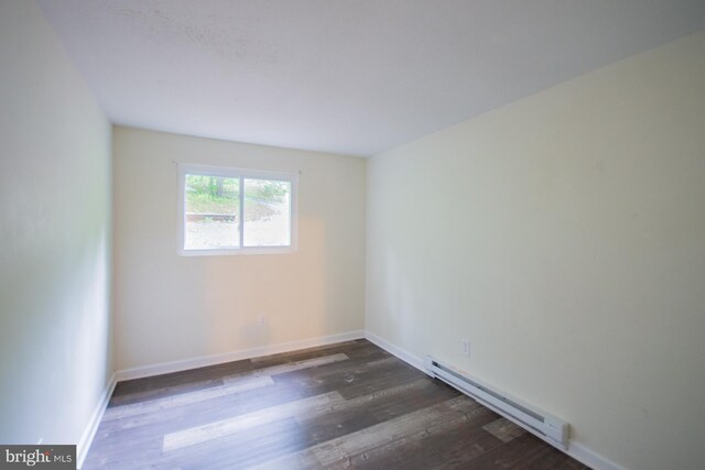 384 Nancy Jack Rd, Gerrardstown, WV 25420 - empty room featuring baseboard heating, wood finished floors, and baseboards