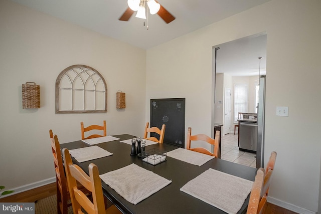 dining room featuring ceiling fan and baseboards