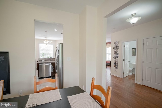 dining area featuring light wood finished floors and recessed lighting