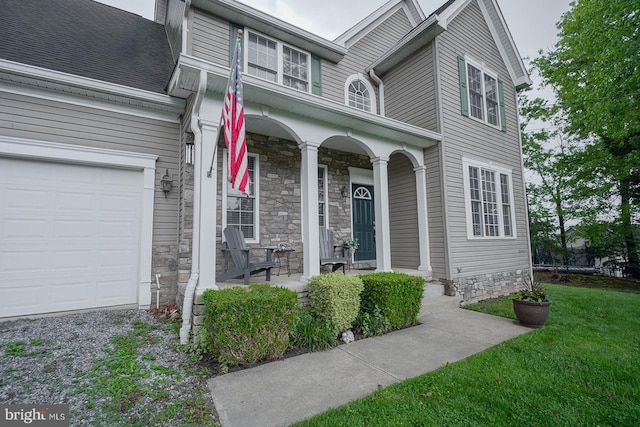 traditional-style home with a porch, stone siding, and a front lawn