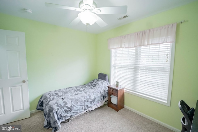 bedroom featuring carpet, baseboards, and ceiling fan