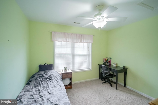 carpeted bedroom featuring a ceiling fan and baseboards