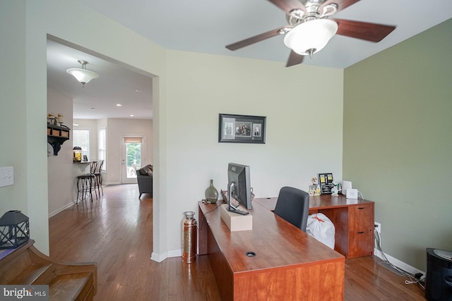 office space featuring wood finished floors, ceiling fan, baseboards, and recessed lighting