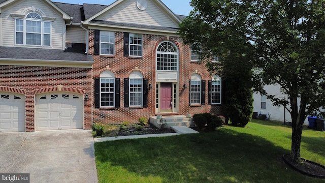 2405 Colber Ct, Waldorf, MD 20603 - georgian-style home featuring brick siding, concrete driveway, a front yard, a garage, and a shingled roof