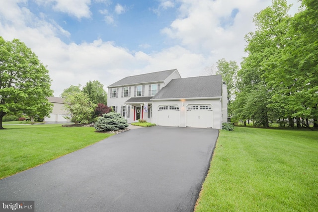 16 Red Oak Dr, Quakertown, PA 18951 - colonial house featuring a garage, driveway, and a front yard