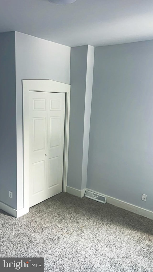 442 S Prince St, Lancaster, PA 17603 - unfurnished bedroom with carpet flooring, baseboards, and a closet