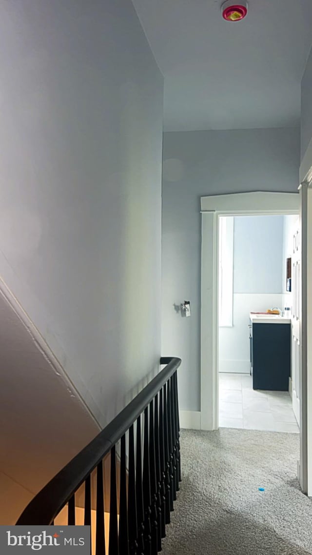 442 S Prince St, Lancaster, PA 17603 - hallway with light colored carpet, an upstairs landing, and baseboards