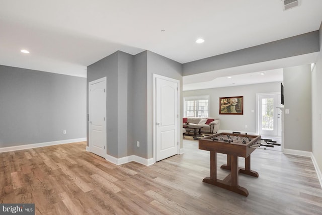 game room featuring light wood-type flooring, baseboards, and recessed lighting