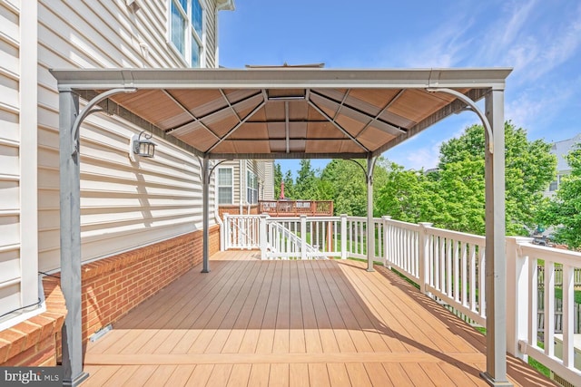 wooden deck featuring a gazebo