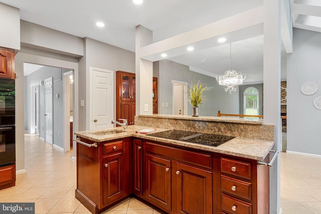 kitchen with a sink, black electric cooktop, light tile patterned floors, dark brown cabinets, and recessed lighting