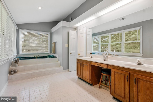 bathroom featuring vaulted ceiling, a garden tub, tile patterned floors, and double vanity