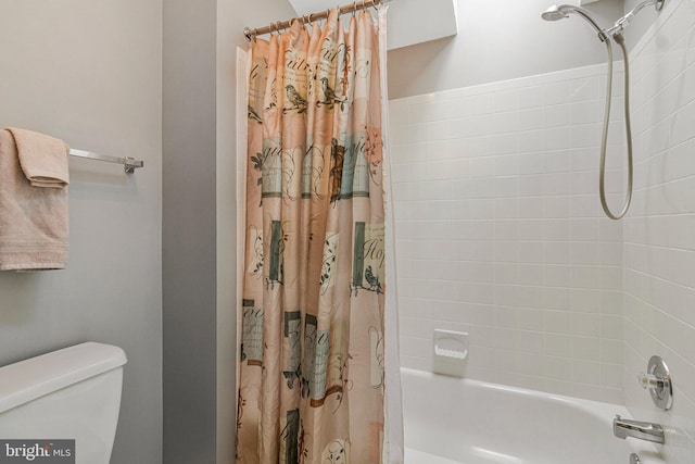 full bath with shower / tub combo and toilet