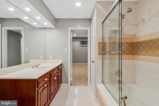 bathroom featuring recessed lighting, tile patterned floors, baseboards, vanity, and tiled shower / bath combo