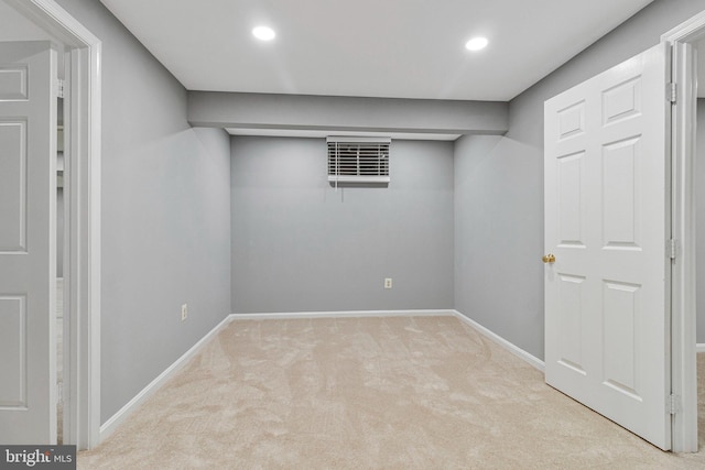 finished below grade area with carpet floors, recessed lighting, and baseboards