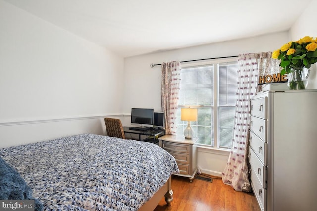 bedroom with wood finished floors