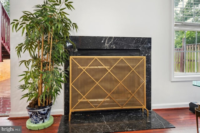 detailed view of baseboards and wood finished floors