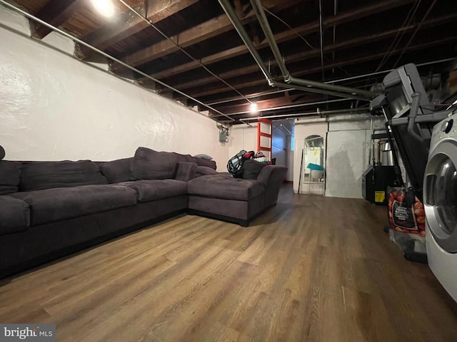 living room with wood finished floors and washer / clothes dryer