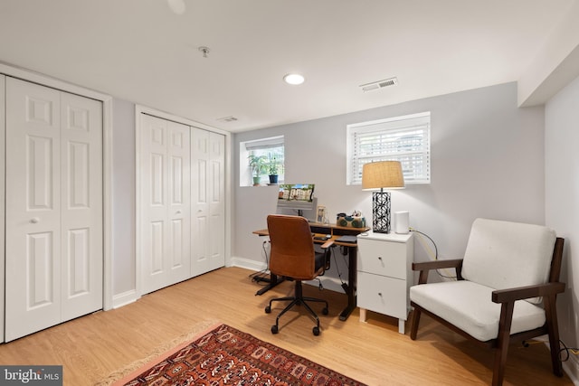 home office with light wood finished floors, baseboards, and recessed lighting