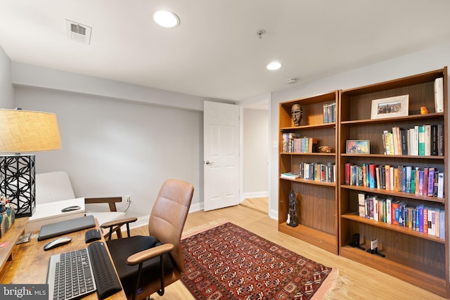 home office with wood finished floors, recessed lighting, and baseboards