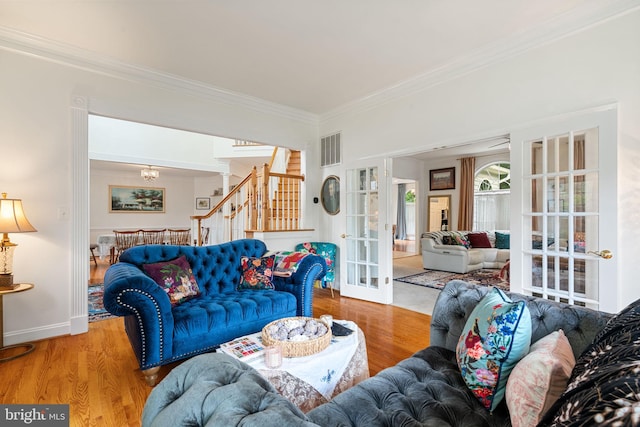 7814 Abbey Oaks Ct, Manassas, VA 20112 - living room with ornamental molding, french doors, wood finished floors, a chandelier, and stairs