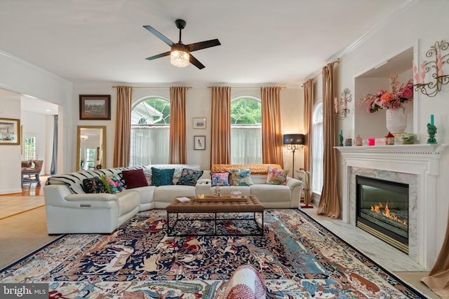 7814 Abbey Oaks Ct, Manassas, VA 20112 - living room featuring crown molding, a ceiling fan, and a premium fireplace
