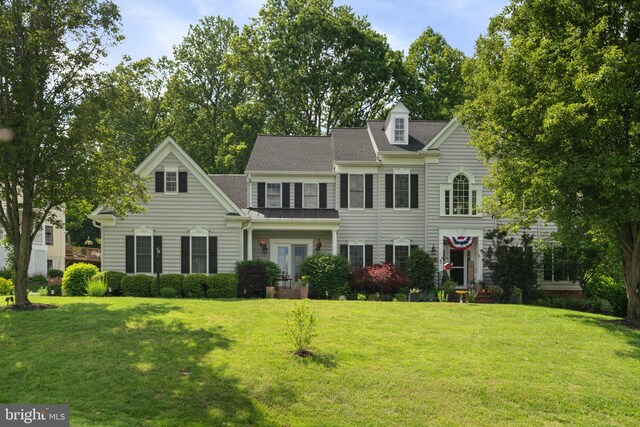 7814 Abbey Oaks Ct, Manassas, VA 20112 - view of front facade with a front lawn and a standing seam roof