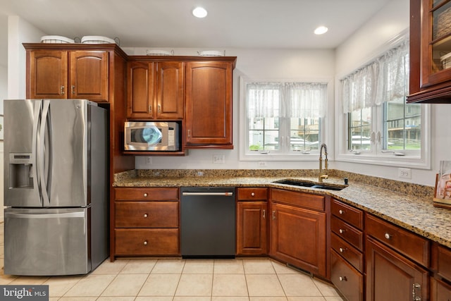 7814 Abbey Oaks Ct, Manassas, VA 20112 - kitchen featuring appliances with stainless steel finishes, a sink, light stone countertops, light tile patterned flooring, and recessed lighting