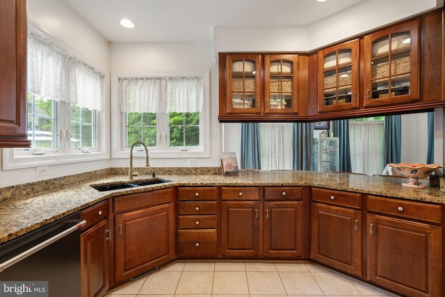 7814 Abbey Oaks Ct, Manassas, VA 20112 - kitchen with a sink, dishwasher, light stone countertops, and light tile patterned floors