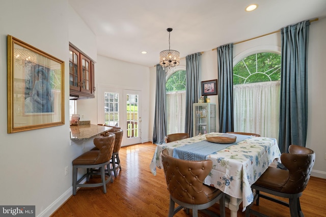 7814 Abbey Oaks Ct, Manassas, VA 20112 - dining area with healthy amount of natural light, light wood-style flooring, baseboards, and recessed lighting