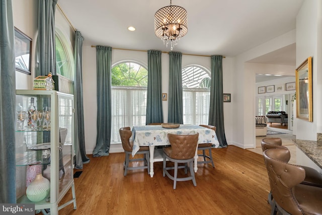 7814 Abbey Oaks Ct, Manassas, VA 20112 - dining room with a chandelier, healthy amount of natural light, light wood-type flooring, baseboards, and recessed lighting