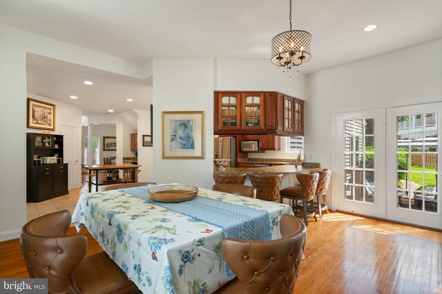 7814 Abbey Oaks Ct, Manassas, VA 20112 - dining room with recessed lighting, a chandelier, and light wood-type flooring