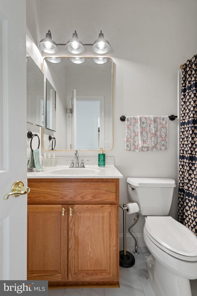 7814 Abbey Oaks Ct, Manassas, VA 20112 - bathroom featuring toilet, vanity, and tile patterned floors