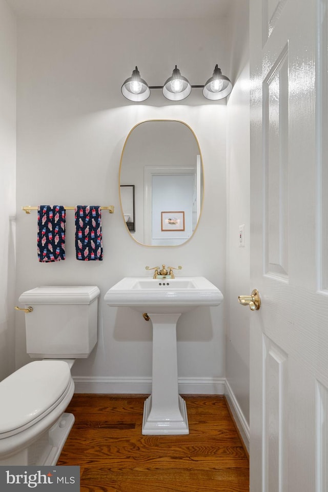 7814 Abbey Oaks Ct, Manassas, VA 20112 - bathroom featuring baseboards, wood finished floors, and toilet