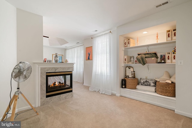 7814 Abbey Oaks Ct, Manassas, VA 20112 - carpeted living area featuring a multi sided fireplace and baseboards