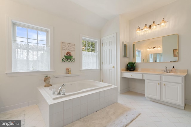 7814 Abbey Oaks Ct, Manassas, VA 20112 - full bathroom with tile patterned floors, a bath, vanity, baseboards, and lofted ceiling