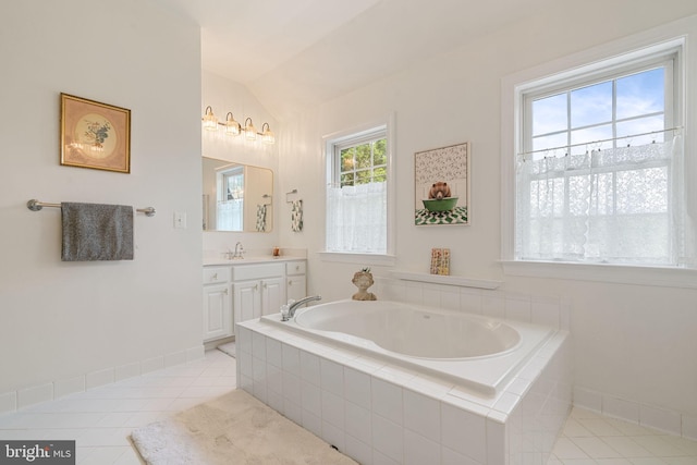 7814 Abbey Oaks Ct, Manassas, VA 20112 - bathroom featuring tile patterned flooring, a garden tub, lofted ceiling, vanity, and baseboards