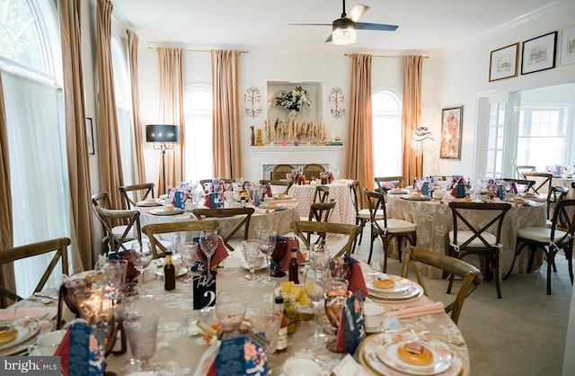 7814 Abbey Oaks Ct, Manassas, VA 20112 - dining room featuring crown molding, carpet floors, and a ceiling fan