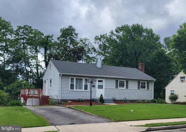 1809 Warren Dr, Woodbridge, VA 22191 - single story home featuring a chimney, a front lawn, roof with shingles, and a wooden deck