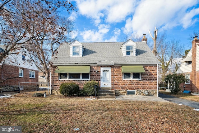 449 E Rively Ave, Aldan, PA 19018 - new england style home with brick siding, a chimney, and roof with shingles
