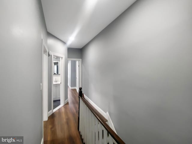 2059 E Atlantic St, Philadelphia, PA 19134 - hall with an upstairs landing, dark wood-style flooring, and baseboards