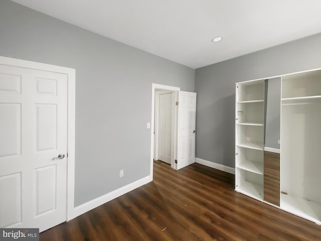 2059 E Atlantic St, Philadelphia, PA 19134 - unfurnished bedroom with dark wood-type flooring, baseboards, a closet, and recessed lighting