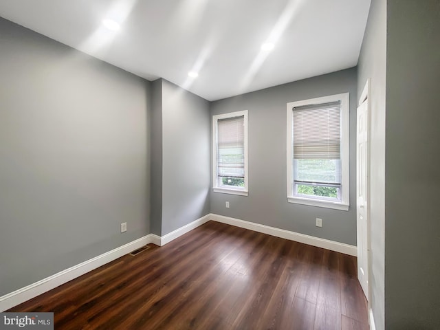 2059 E Atlantic St, Philadelphia, PA 19134 - empty room with baseboards and dark wood-style flooring