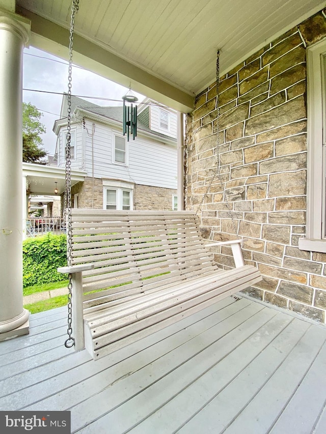 wooden deck featuring covered porch