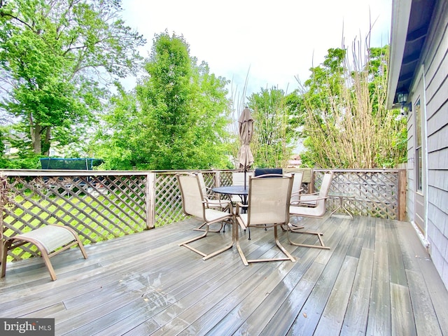wooden deck with outdoor dining area