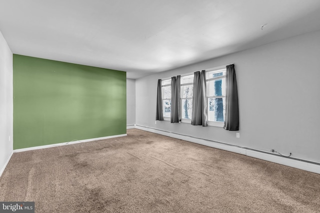 102 Sunset St, Browns Mills, NJ 08015 - empty room with baseboard heating, carpet, and baseboards